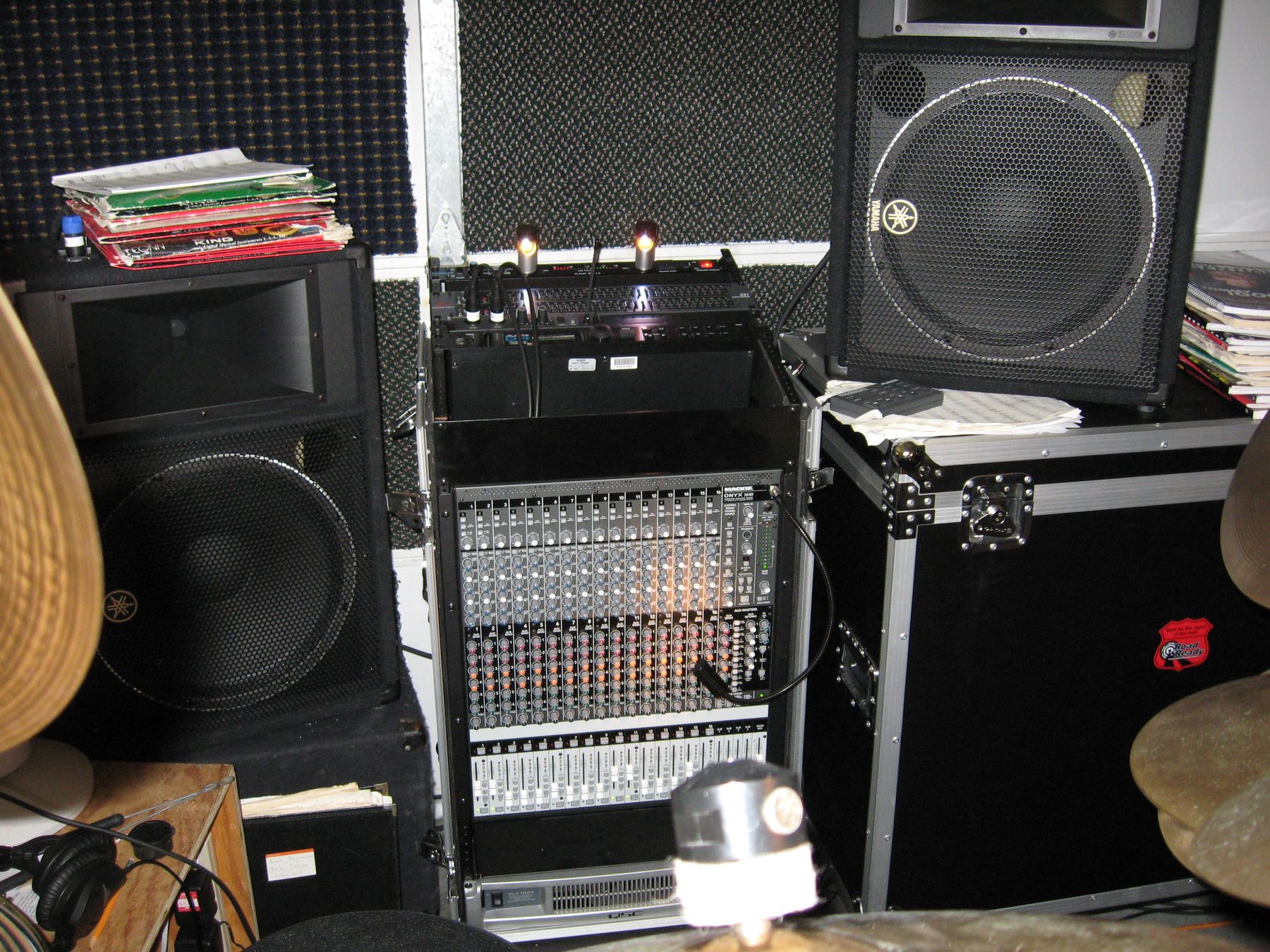 The Mackie Onyx mixer in a rack beside Yamaha monitors