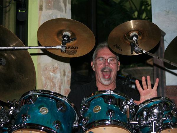 Bruce waving from behind the kit