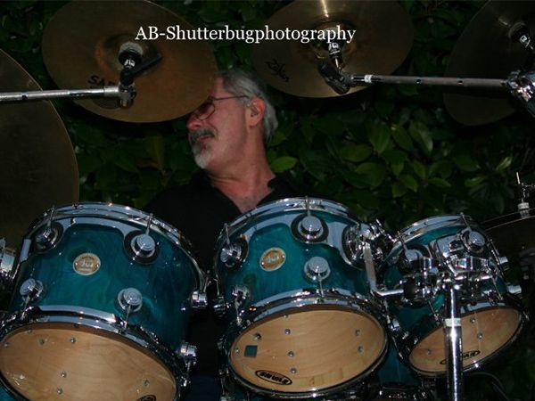 Bruce playing the DW kit outdoors at night