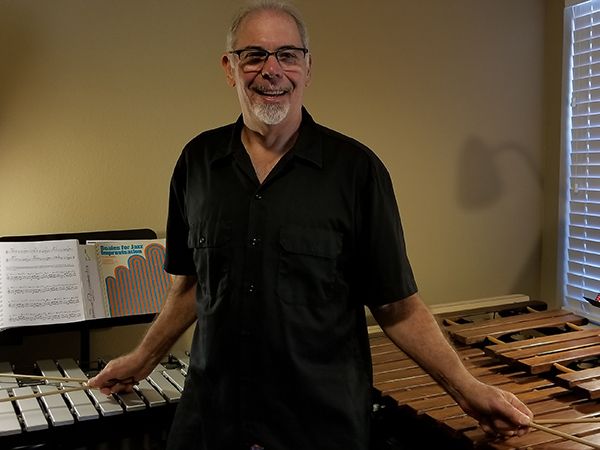 Bruce smiling at the marimba